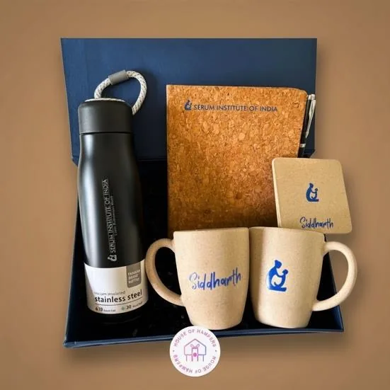 Eco-friendly gift kit with a cork diary, steel bottle and printed mugs