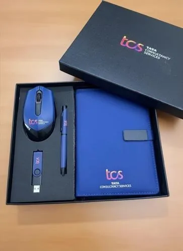 TCS-branded joiner kit with a blue diary, pen and wireless mouse