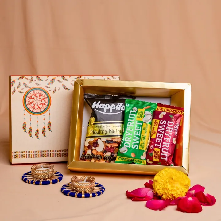 Elegant Essence Hamper, a Diwali gift hamper with Happilo Nutmix, Happilo Dryfruit Sweets and T-light candles