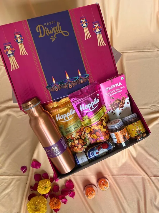 Golden Treats & Wellness Box, a Diwali gift hamper with Copper bottle, Happilo Party Snack and Happilo Cajun Almond Cashew Mix